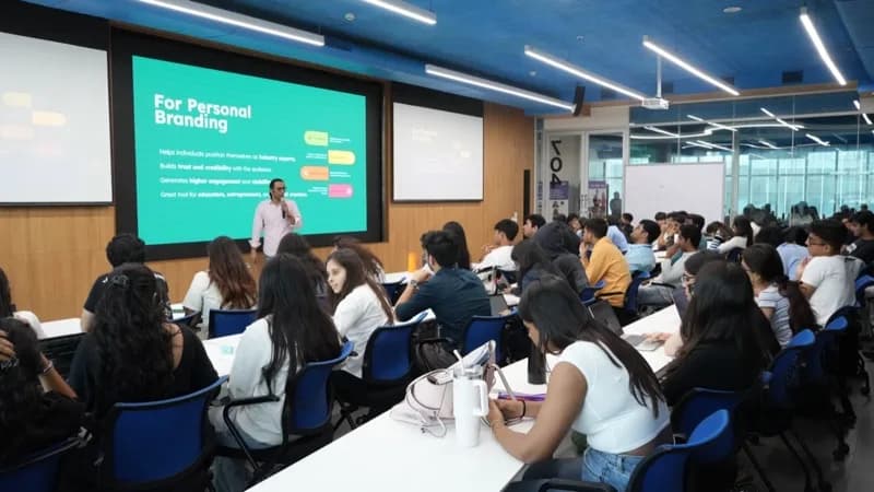 Trainer presenting a personal branding session to a packed classroom
